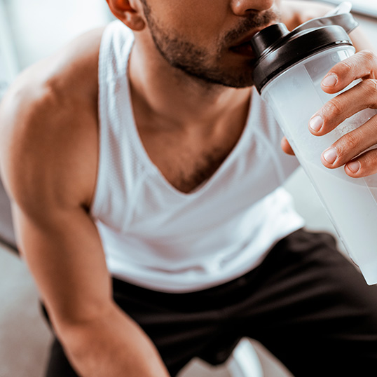 Person consuming an AminoVital drink