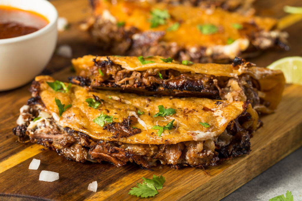 Homemade Steak Birria Meat Tacos with Cheese and Sauce