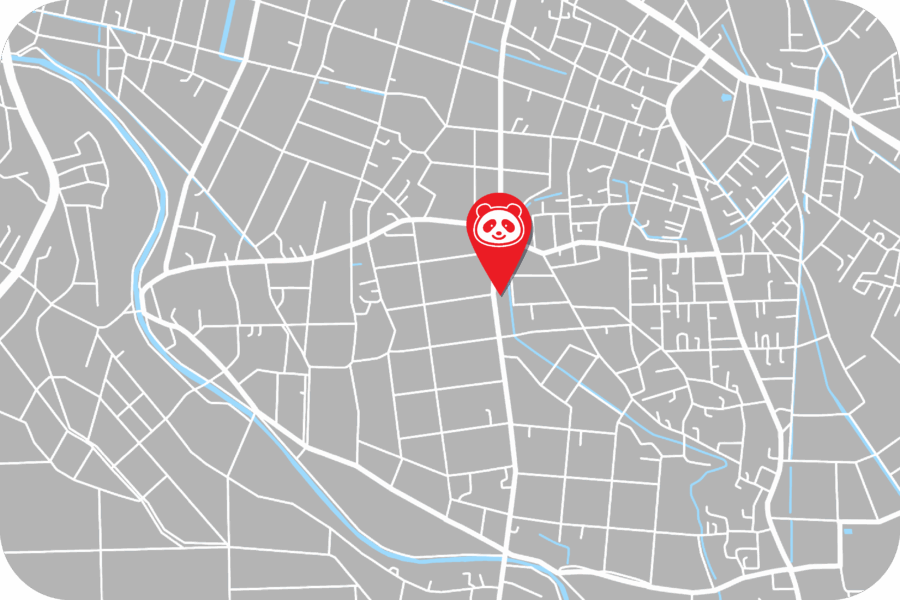 A gray city street map with a red location pin featuring a panda face, marking a specific spot near the center.