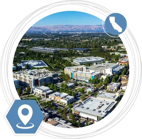 Skyline view of the California location in a circle with a pin icon and and icon of the state of California.